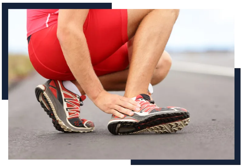 Runner holding the bottom of his foot
